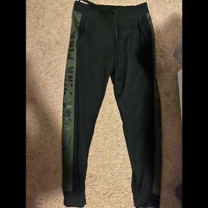 sweats from pink, black with dark green on the side of them
